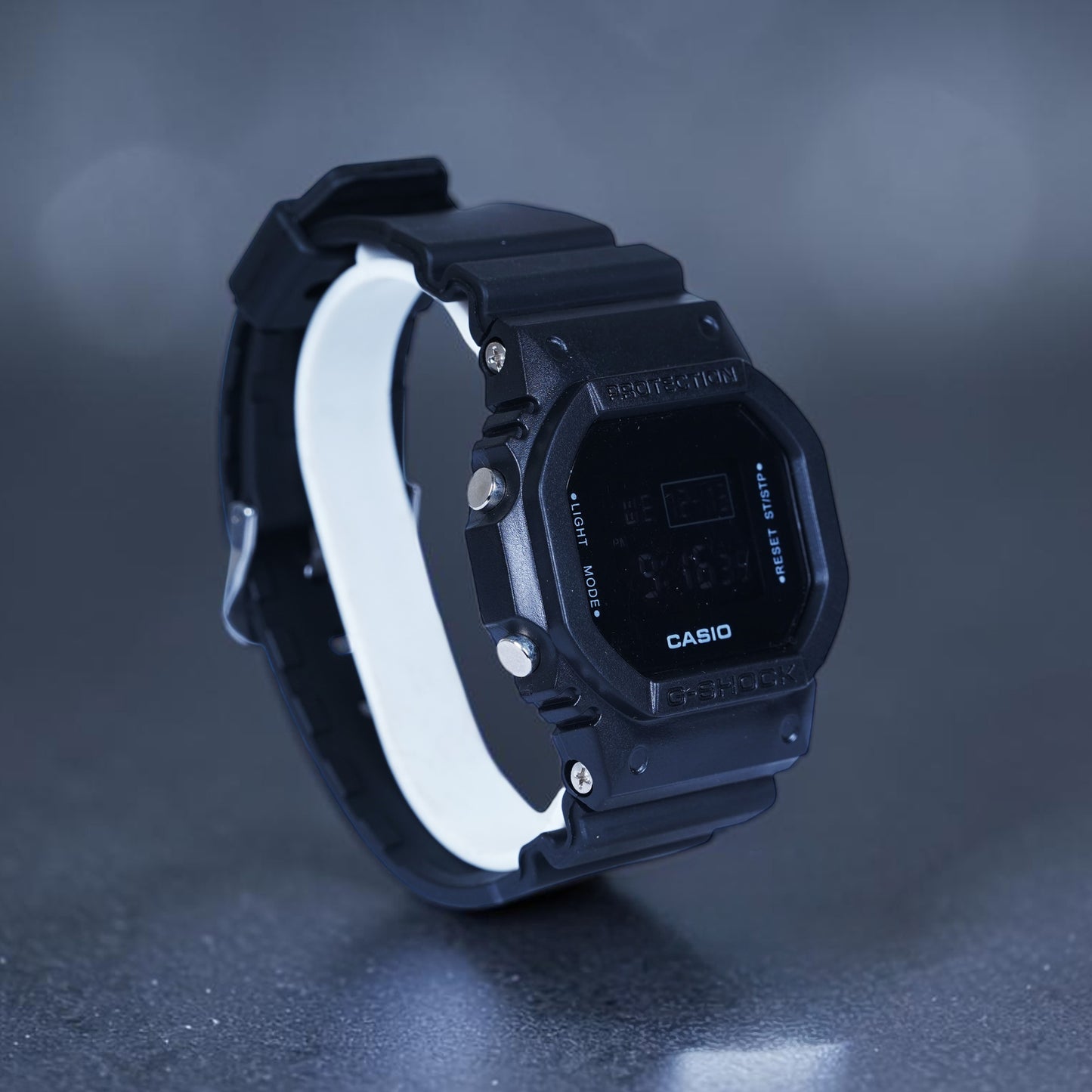 Casio G Shock Watch (featuring a matte black finish and a negative digital display)