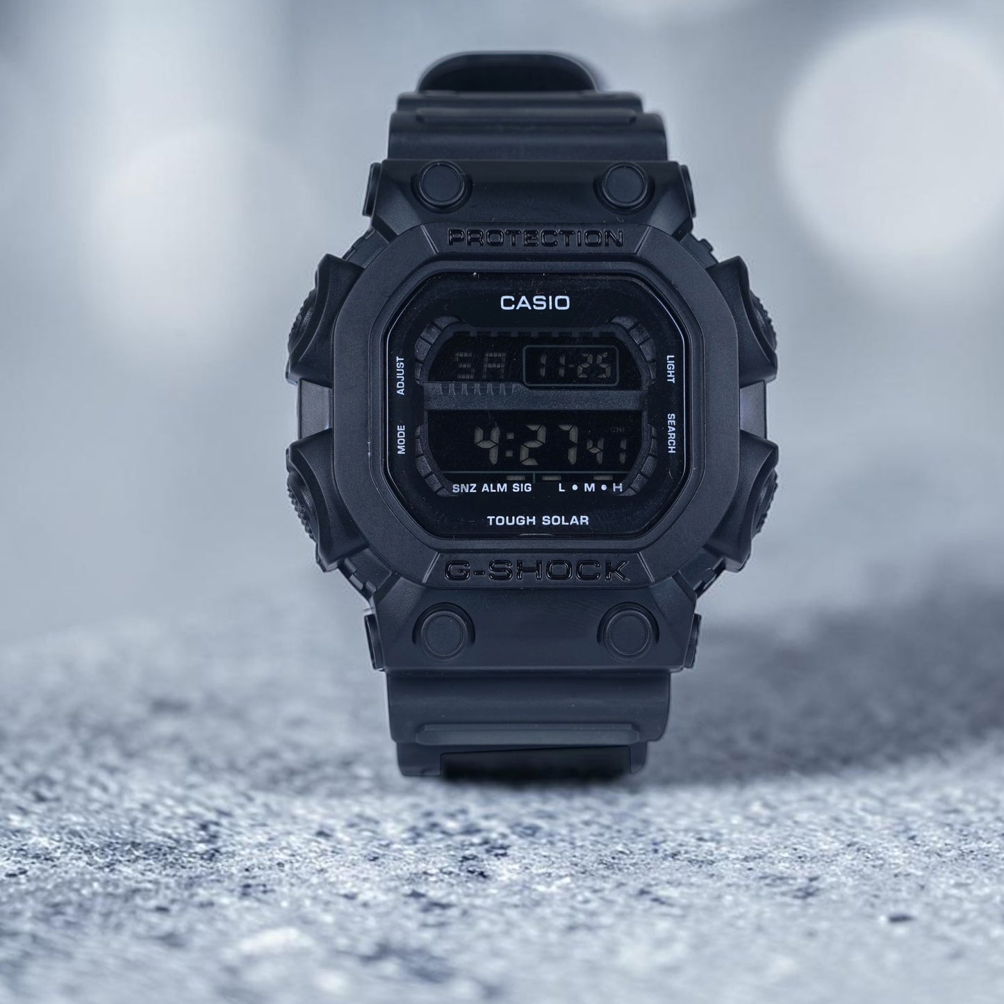 Casio G Shock (all-black digital watch featuring a tough solar power system)