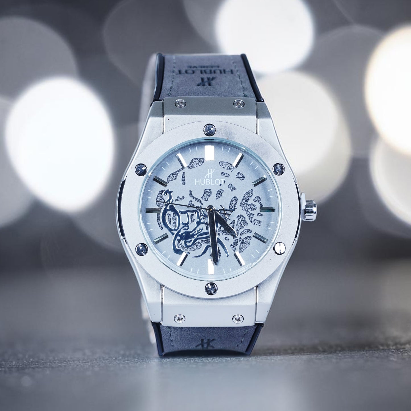 Hublot watch (abstract patterns and a grey strap)